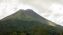 T/L Arenal volcano in clouds Stock Footage