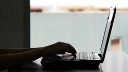 Close up of a hand typing on laptop keyboard Stock Footage