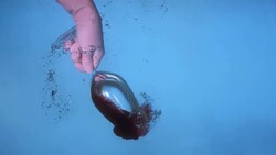 HD Super Slow-Mo: Sinking A Glass With Red Wine Stock Footage