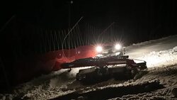 Machine for leveling the ski slopes works at night. Stock Footage
