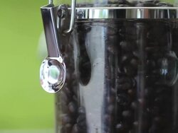 Coffee beans in glass jars,Dolly shot Stock Footage