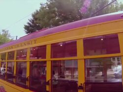 Camera drives by  downtown Little Rock trolley, Central Arkansas Transit Stock Footage