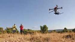 Two drone operators operating a drone Stock Footage