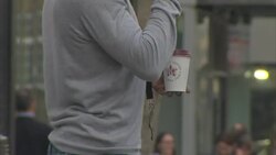 Anonymous people carrying disposable coffee cups News Clip
