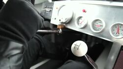 Stock-car driver shifts gears Stock Footage