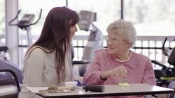 Occupational therapist working with a geriatric patient in a clinic Stock Footage