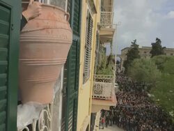 MS Clay jugs throwing from windows down to town square esplanade on easter celebration AUDIO / Kerkyra, Corfu, Greece Stock Footage