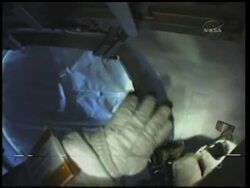 Astronauts on spacewalk outside ISS; mission briefing Instructional Video