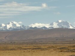 L-R Pan of Andes mountain range in Bolivia, including Huayna Potosi Stock Footage