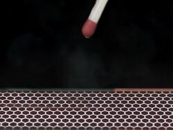 Wooden Match striking on matchbox, igniting and burning Stock Footage