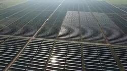 Aerial Drone Fly Over Solar Power Plant with thousands of Solar Panels array Stock Footage