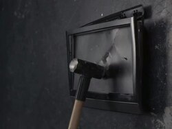 TV screen being smashed by hammer, slow motion-close up Stock Footage
