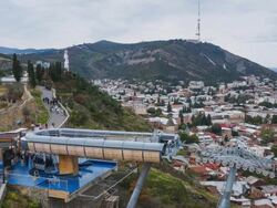 TL Cableway in Tbilisi and Monument Georgia-mother on the background / Georgia Stock Footage
