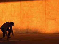 A young man skateboarding in a parking garage. - Slow Motion - filmed at 240 fps Stock Footage