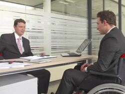 HD DOLLY: Disabled Businessman Handshaking With Manager Stock Footage