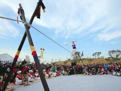 WS LA Shot of tightrope walker doing acrobatics on high wire / Gyeonggido, South Korea Stock Footage