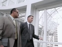  TS Associates walking through lobby of building, talking and laughing, / Seattle, Washington, United States Stock Footage