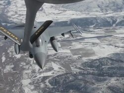 MS F-16 fighter jet refueling in mid-air, Colorado Rockies, Colorado, USA Stock Footage