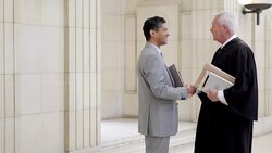 Lawyer and judge greeting at courthouse Stock Footage