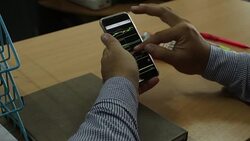 Businessman analyzing data on mobile Stock Footage