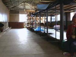 MS Shot of Porter poses for portrait inside porter house in Namche Bazarre / Namche, Nepal Stock Footage