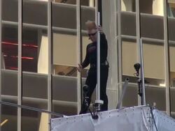 Bello Nock, 'The Ultimate Daredevil' kicks off his 'The Summer of Bello' in Times Square by setting a record for eight consecutive hours on a high-wire Stock Footage