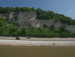 AERIAL MS TS Car moving on highway near Mississippi river / St Louis, Missouri, United States Stock Footage