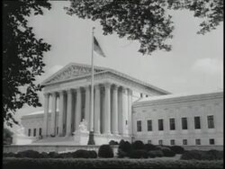 An American flag flies outside of the United States Supreme Court Building. News Clip