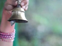 Indian lady is ringing bell Stock Footage