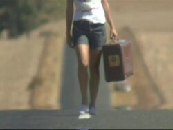 Young woman carrying suitcase, Cape Town, South Africa Stock Footage