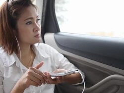 Close up women is listening song with smart phone Stock Footage