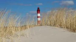Lighthouse in the dunes Stock Footage