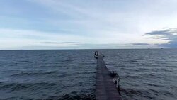 Aerial : low flying over wooden pier Stock Footage