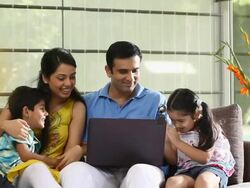 Family chatting on a laptop  Stock Footage