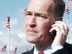 CU Man talking on mobile in front of American flags / Washington, DC, USA Stock Footage