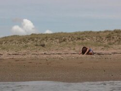 Beach Yoga: Sitting Up after Forward Stretches Stock Footage