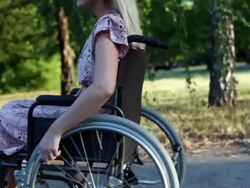 HD: Young Woman in a wheelchair. Stock Footage