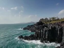 WS T/L View of Landscape of Coastal Feature at Jusangjeolli ( spectacular volcanic rock formation at southern coast of Jeju Island or columnar joint ) / Jejudo, South Korea Stock Footage