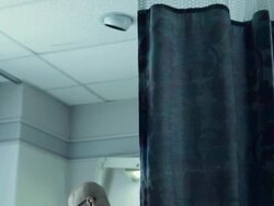 Senior man reading card on hospital bed Stock Footage