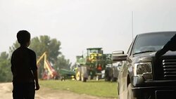 Caucasian father and son talking to truck driver Stock Footage