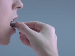 CU SLO MO Woman taking bite from wafer Stock Footage