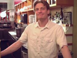 Portrait of a male bartender smiling at the camera. Stock Footage