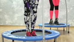 Trampoline squats Stock Footage