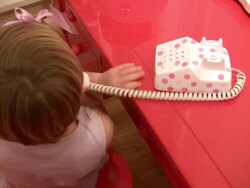 Junior Executive Telephone Skills; Child Talks on Toy Phone Stock Footage
