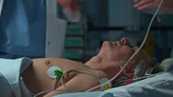 Medical team resuscitating a male patient in emergency room Stock Footage