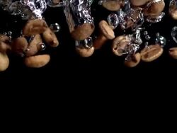 Coffee Beans Falling Into Water (Super Slow Motion) Stock Footage