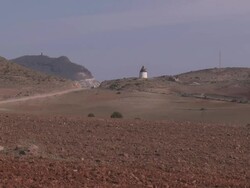 WS View of Windmill  Molino de Viento Cabo in de Gata Natural Park / San Jose, Andalusia, Spain Stock Footage