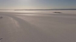 4K aerial shot of a frozen Lake Champlain in Vermont in the winter Stock Footage