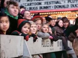 1944/45 children standing behind barricade at Macy's Thanksgiving Day Parade / newsreel Stock Footage