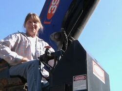 MS ZI Crane operator at working during framing of an energy efficient post / Grass Lake, Michigan, USA  Stock Footage